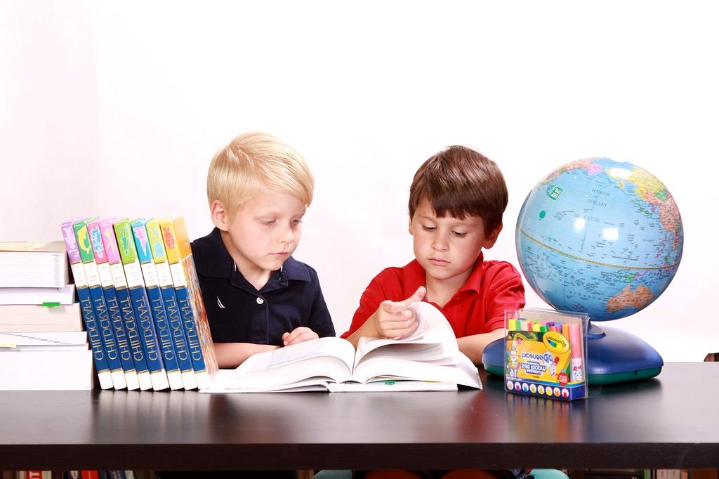 Assorted published educational materials and digital resources on a desk